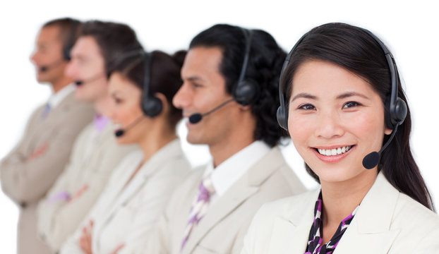 Confident business team with headset on standing in a row