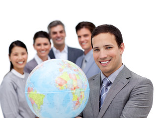 Victorious business team holding a terrestrial globe