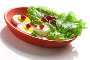 Egg  salad on a red round dish