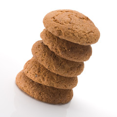 Stack of tasty oatmeal cookies over white background