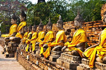 Fototapeta na wymiar Buddha statues at temple of Wat Yai Chai Mongkol in Ayutthaya