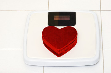 red heart on bathroom scale