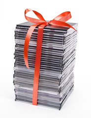 Pile of optical disc with red ribbon