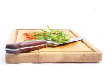 Cooking plank with Ggreen and red bell pepper