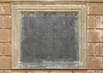 Naklejka premium Empty square medallion on ancient wall