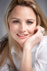 Studio Portrait Of Woman Wearing White Shirt