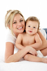 Studio Portrait Of Mother With Young Baby Boy