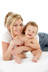 Studio Portrait Of Mother With Young Baby Boy