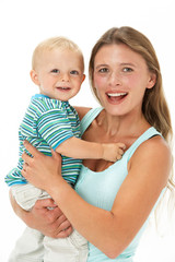 Studio Portrait Of Mother Holding Son