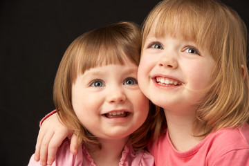 Studio Portrait Of Two Sisters