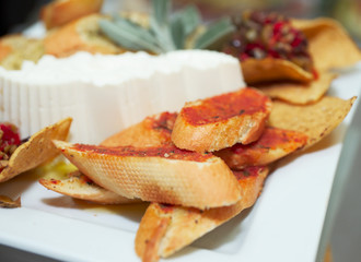 Plate with snacks on banquet table