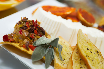 Plate with snacks on banquet table