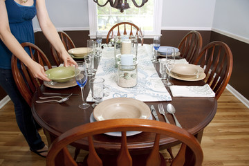 Woman Setting Table