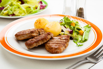 Grilled steaks and vegetables