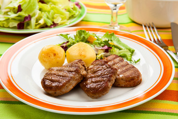 Grilled steaks and vegetables