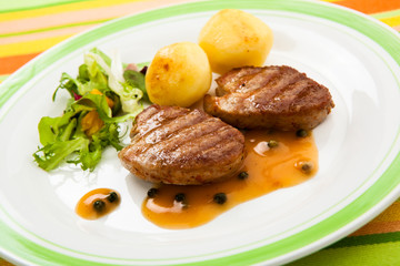 Grilled steaks and vegetables