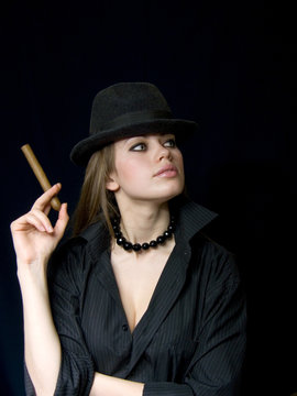 woman in a cap and with a cigarette