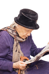 The old lady reads the newspaper