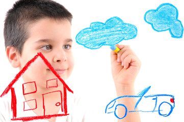 Obraz premium Adorable 6 years old boy painting a house on glass.
