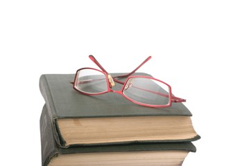 glasses at old books