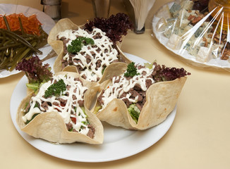 The meat salad wrapped in a corn flat cake