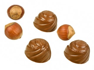 Chocolates and hazelnuts isolated on a white background