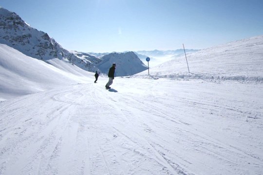 alpine skiing: going down a blue slope in French Alps