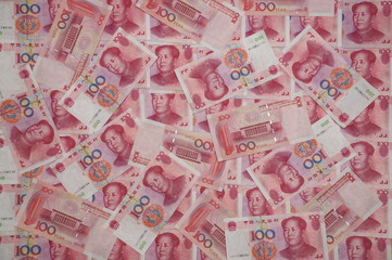 100 Yuan Chinese banknotes scatered