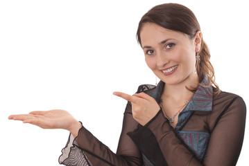 Attractive woman holding and pointing at an imaginary product