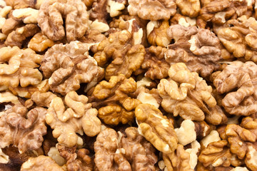 Brown raw walnuts textured background