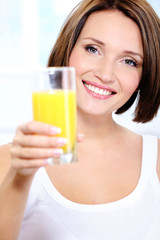 Attractiv happy Woman with glass of  orange juice