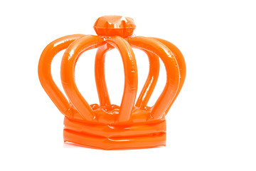 Orange blown up crown over white background