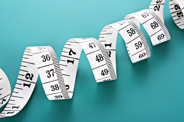 Tape Measure on blue background.