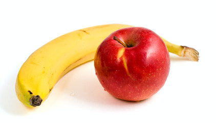 yellow banana and ripe red apple