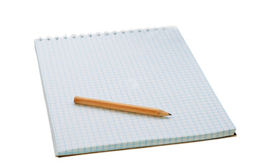 pensil on the notebook isolated on white .