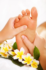 Obraz na płótnie Canvas Exotic foot massage and spa foot treatment.