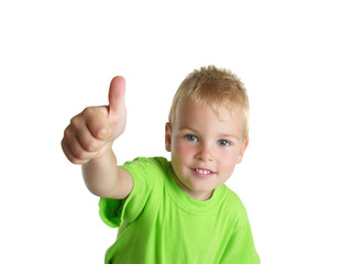 smiling boy shows ok gesture isolated on white background