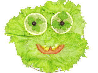 Fototapeta na wymiar face shape on lettuce vegetable