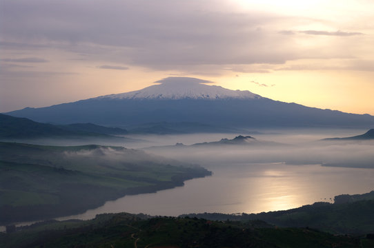 misty on lake and mount Etna
