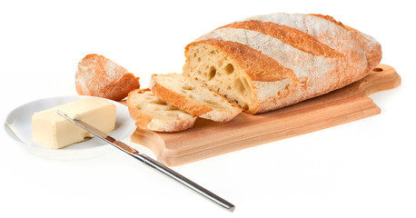 piece of butter, bread and a knife