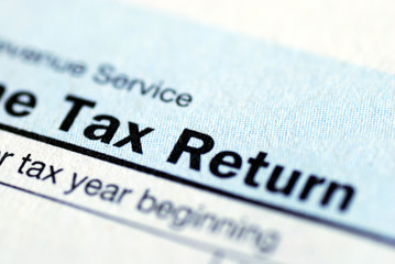 Close up view of the income tax return - obrazy, fototapety, plakaty