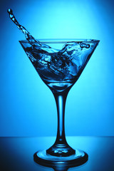 glass of martini with splash