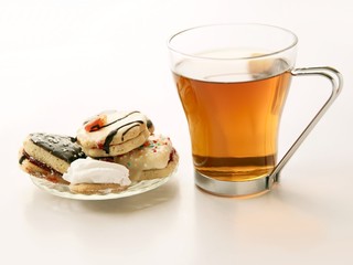 glass of tea and cakes