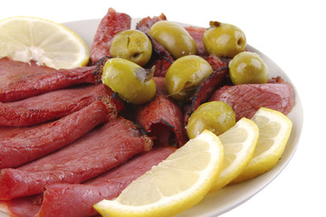 sliced served sausage with raw lemon