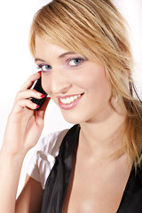 Young smiling woman calling by phone