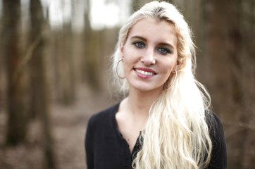 Naklejka premium Young woman in the woods.