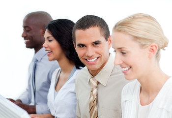 Fototapeta premium Charming businessman and his team at work