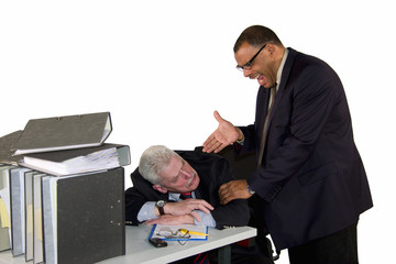 sleeping senior businessman being waked up by his angry boss