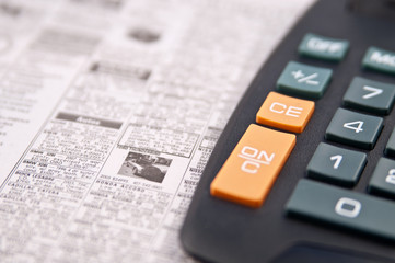 calculator on a daily newspaper