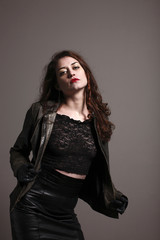 Sexy young woman wearing leather